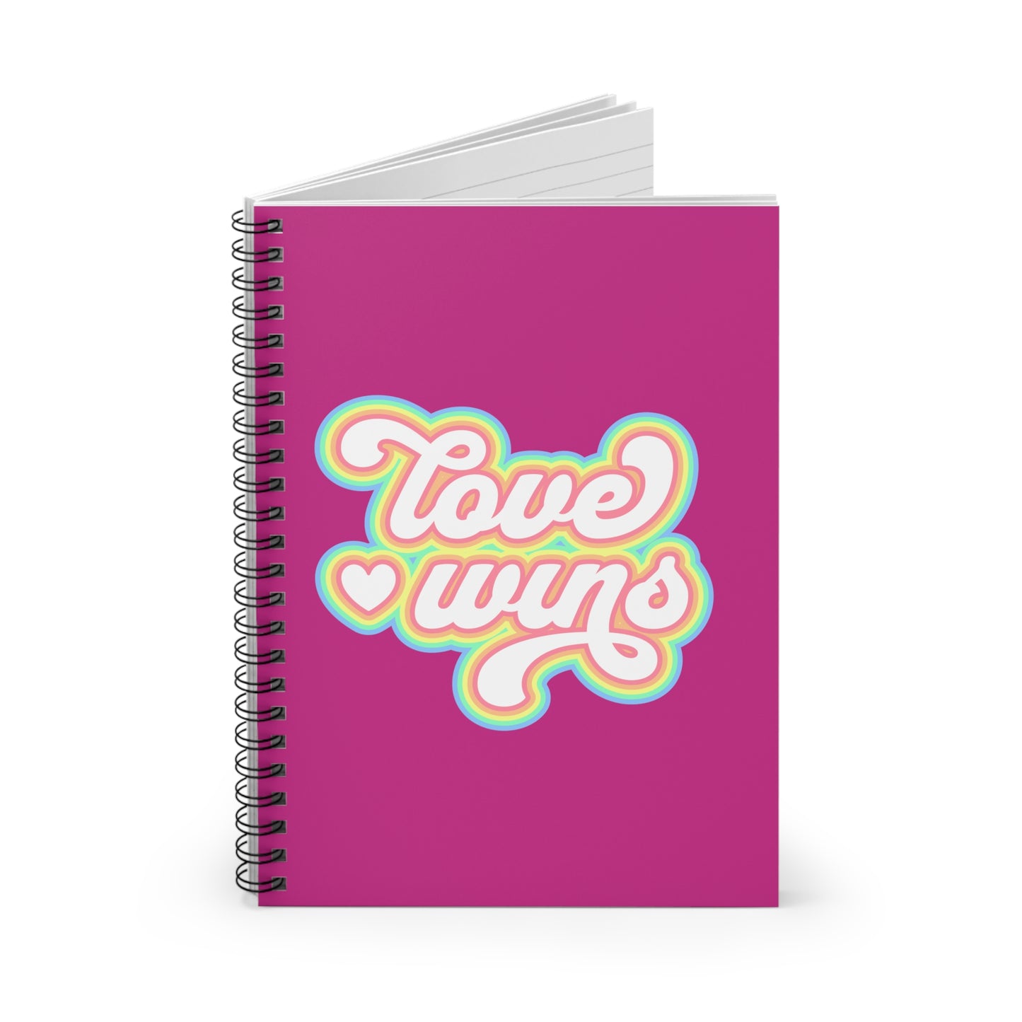 Pink notebook with 'Love wins' text on a white background