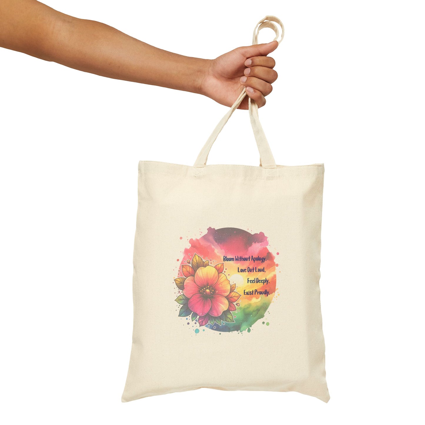 Tote bag with floral design and text held by a hand on a white background