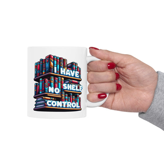 Mug with colorful bookshelf design and text 'HAVE NO SHELF CONTROL' held by a hand.