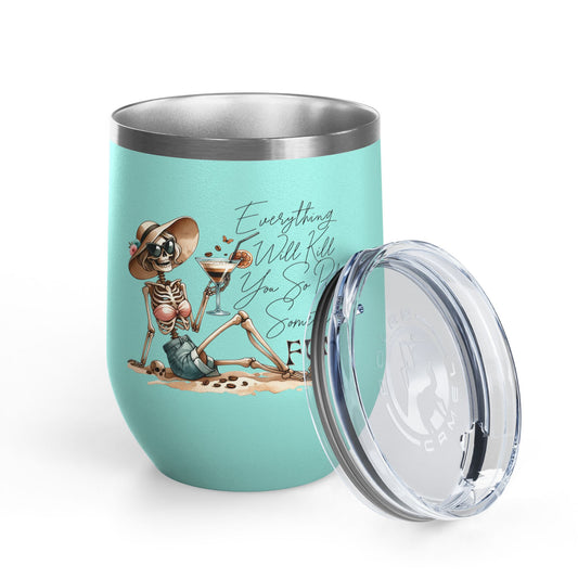 Turquoise tumbler with skeleton design and text on a white background