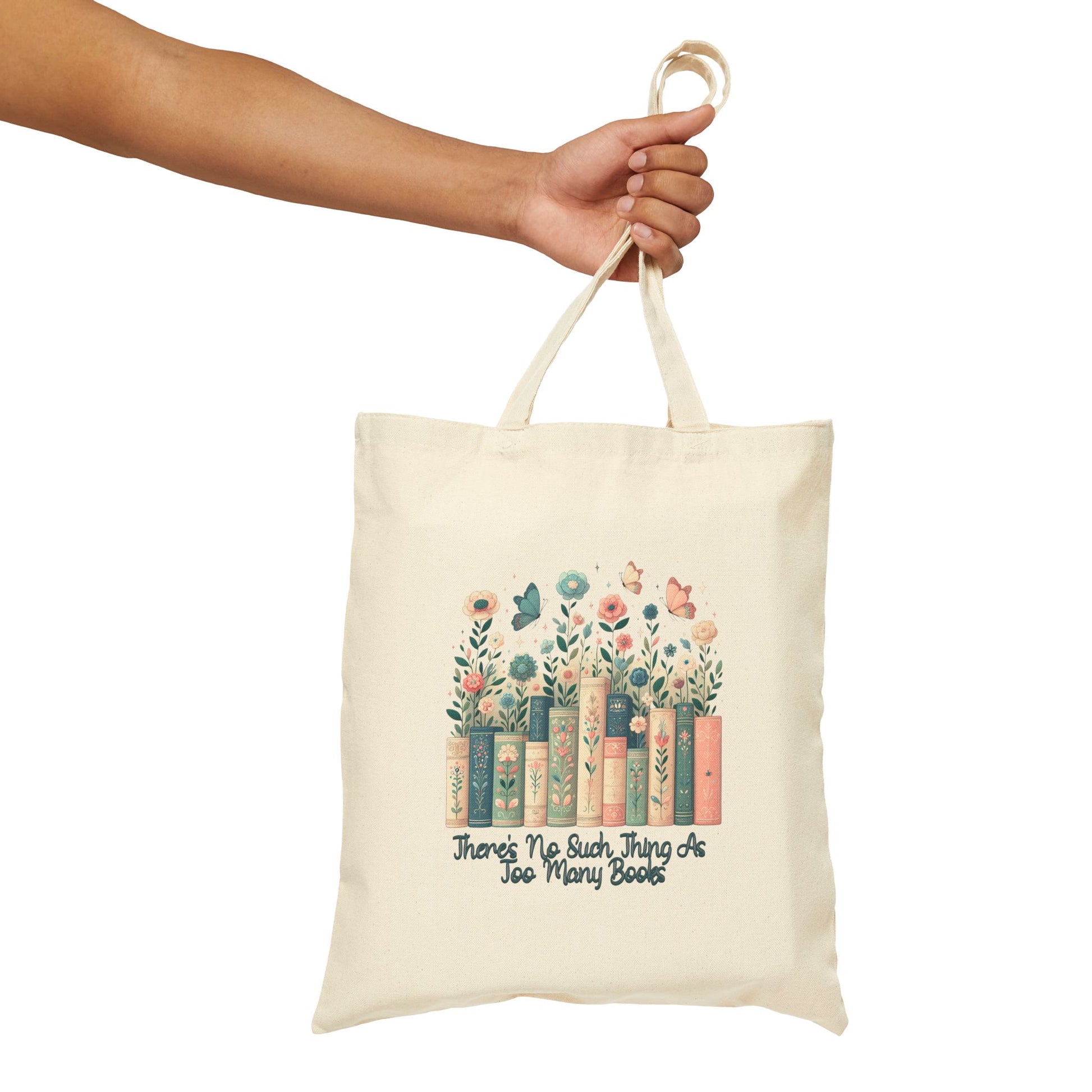 Cotton canvas tote bag with floral book stack and text “There’s No Such Thing as Too Many Books” – book lover design with pastel flowers and butterflies
