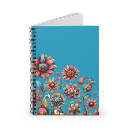 Colorful spiral-bound floral notebook on blue background with whimsical illustrated flower pattern.