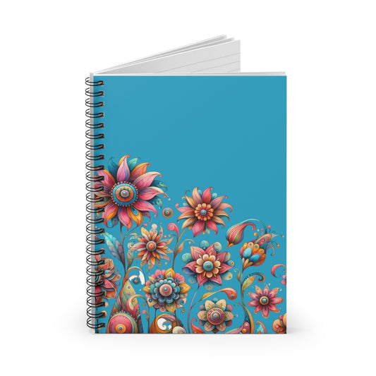 Colorful spiral-bound floral notebook on blue background with whimsical illustrated flower pattern.