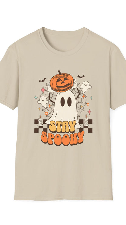 Beige t-shirt with Halloween-themed design featuring a ghost, pumpkin, and text on a white background.