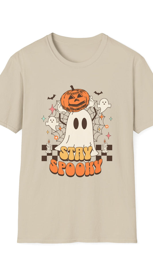Beige t-shirt with Halloween-themed design featuring a ghost, pumpkin, and text on a white background.