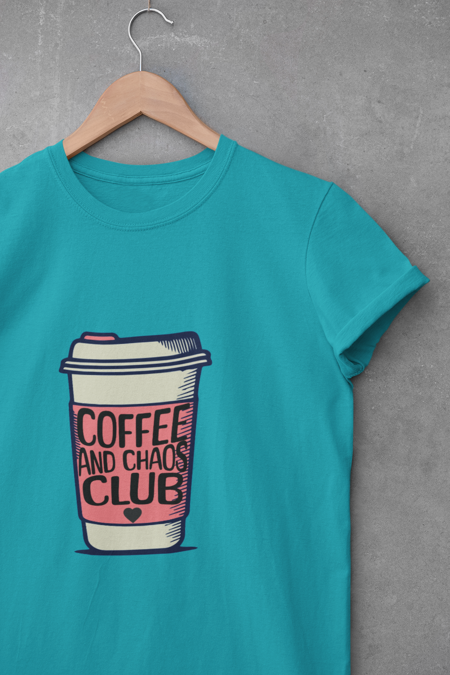 Turquoise t-shirt with coffee cup graphic and “Coffee and Chaos Club” text – funny graphic tee for coffee lovers