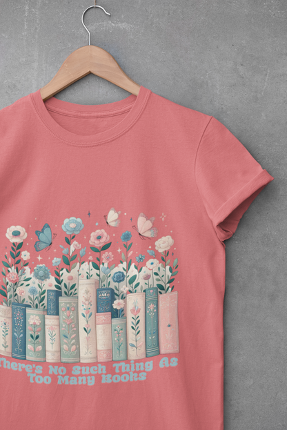 Dusty rose t-shirt with floral book stack and text “There’s No Such Thing as Too Many Books” – graphic tee for book lovers and readers