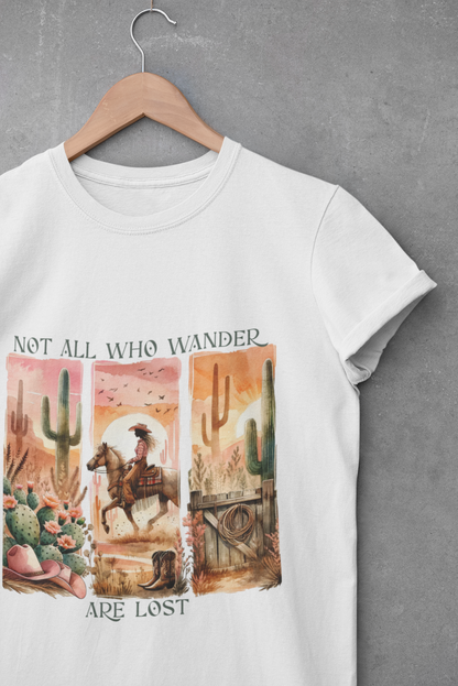 White unisex t-shirt featuring a western desert scene and the phrase “Not All Who Wander Are Lost”