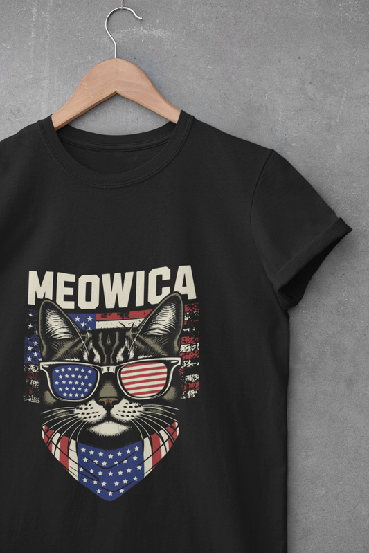 Black t-shirt featuring a cat wearing USA flag sunglasses and bandana with the word “Meowica”