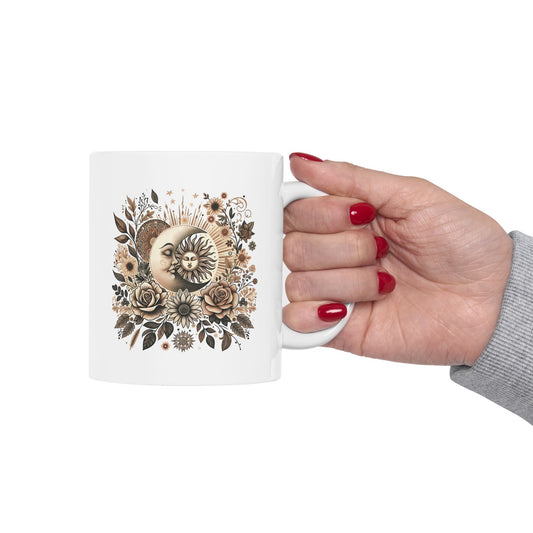 Ceramic mug with floral sun and moon design in warm celestial tones and a glossy finish