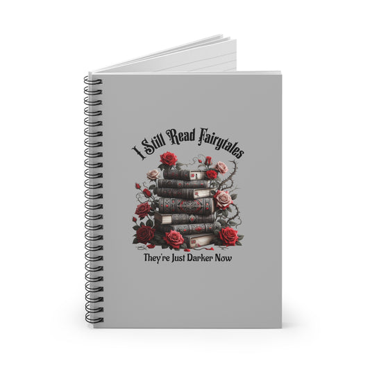Notebook with spiral binding and decorative design on a white background