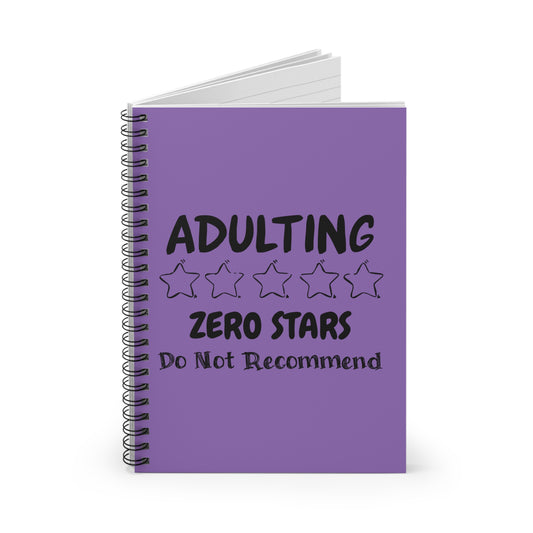 Purple spiral notebook with bold black text reading “Adulting – Zero Stars, Do Not Recommend”