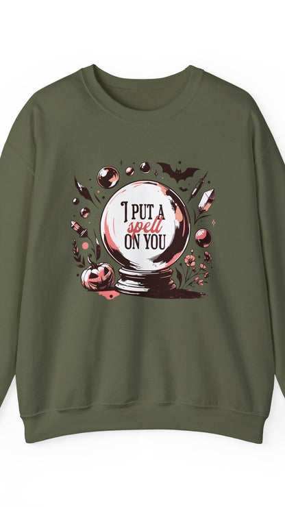 Green sweatshirt with a Halloween-themed graphic and text on a white background