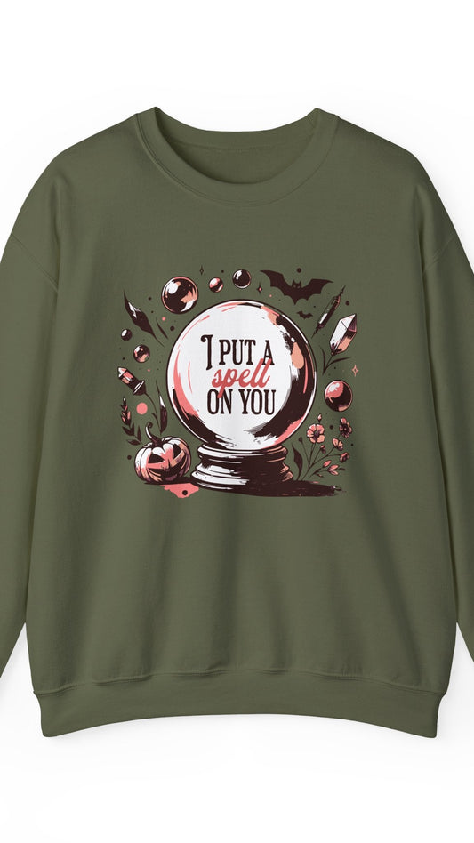 Green sweatshirt with a Halloween-themed graphic and text on a white background