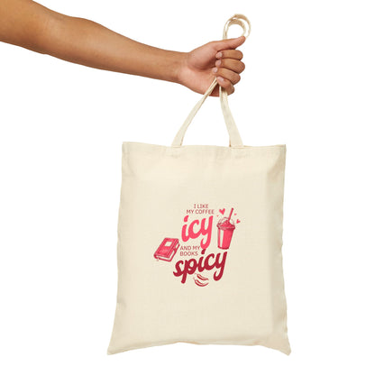 Natural cotton tote bag with pink text reading “I like my coffee icy and my books spicy,” featuring icons of an iced drink and a book.