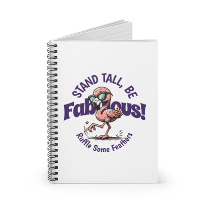 A spiral journal notebook with a white cover featuring a colorful flamingo character and the text 'STAND TALL, BE FABULOUS!'