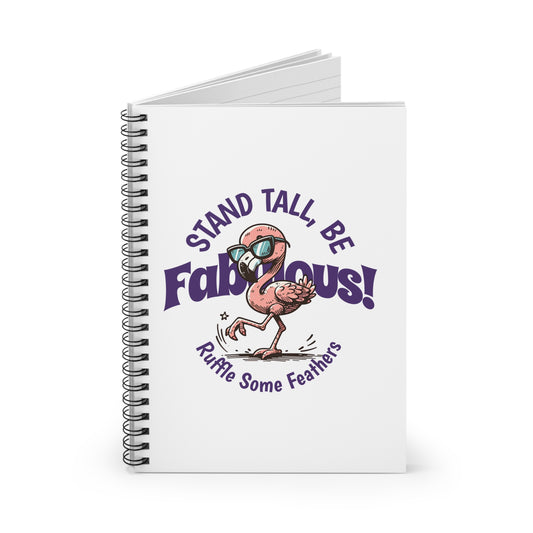 A spiral journal notebook with a white cover featuring a colorful flamingo character and the text 'STAND TALL, BE FABULOUS!'