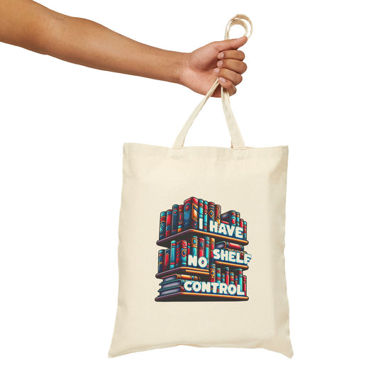 Tote bag with colorful bookshelf design and text held by a hand on a white background